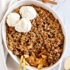 This Healthy Apple Crisp is loaded with tender apples and warm spices, naturally sweetened with maple syrup, all topped with a crunchy oatmeal pecan topping!