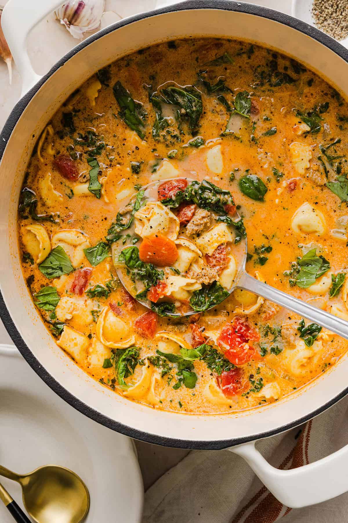 This Creamy Tortellini Soup is cozy, comforting and made with tender cheese tortellini, fresh veggies, herbs and a rich creamy broth. The perfect one pot meal that is both flavorful and satisfying!