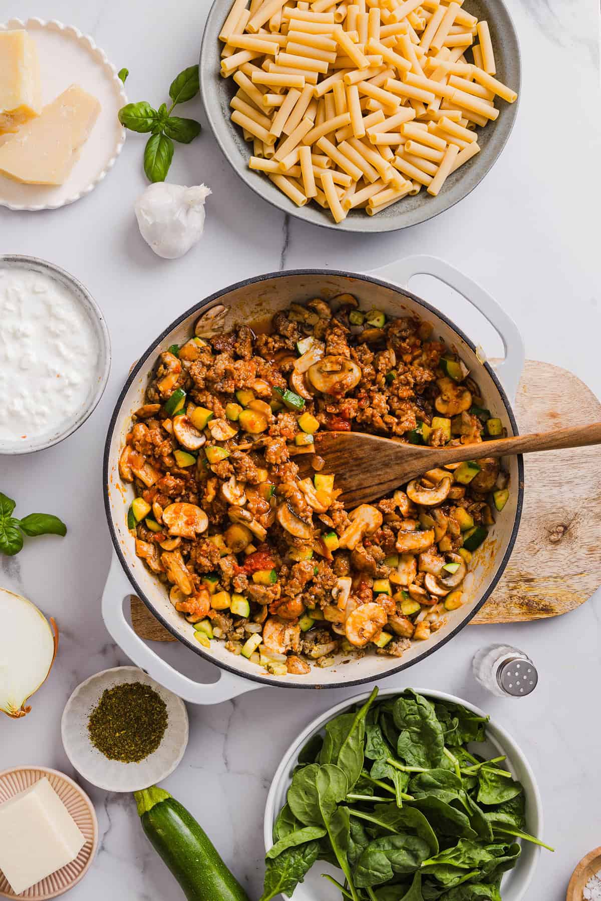 Comforting and delicious Healthy Baked Ziti packed with veggies, flavorful turkey sausage and makes the perfect weeknight meal the whole family will love!  Leftovers guaranteed!