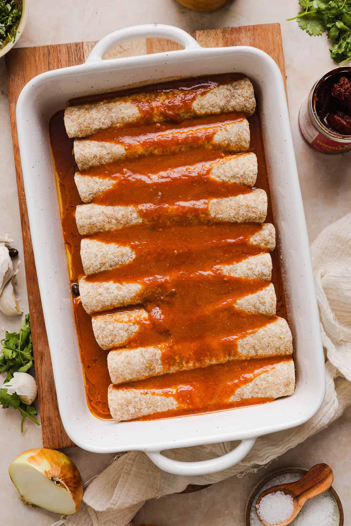 This Healthy Chicken Enchilada recipe is a family favorite made with wholesome, flavorful ingredients for the perfect weeknight meal! The homemade enchilada sauce tastes absolutely amazing!