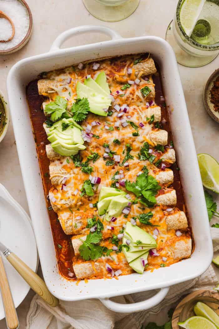 This Healthy Chicken Enchilada recipe is a family favorite made with wholesome, flavorful ingredients for the perfect weeknight meal! The homemade enchilada sauce tastes absolutely amazing!