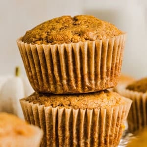 These Whole Wheat Pumpkin Muffins are moist, fluffy, and made healthier with whole wheat flour, applesauce, and zero butter or refined sugar.  Loaded with delicious pumpkin flavor and warm spices for the perfect fall muffin!