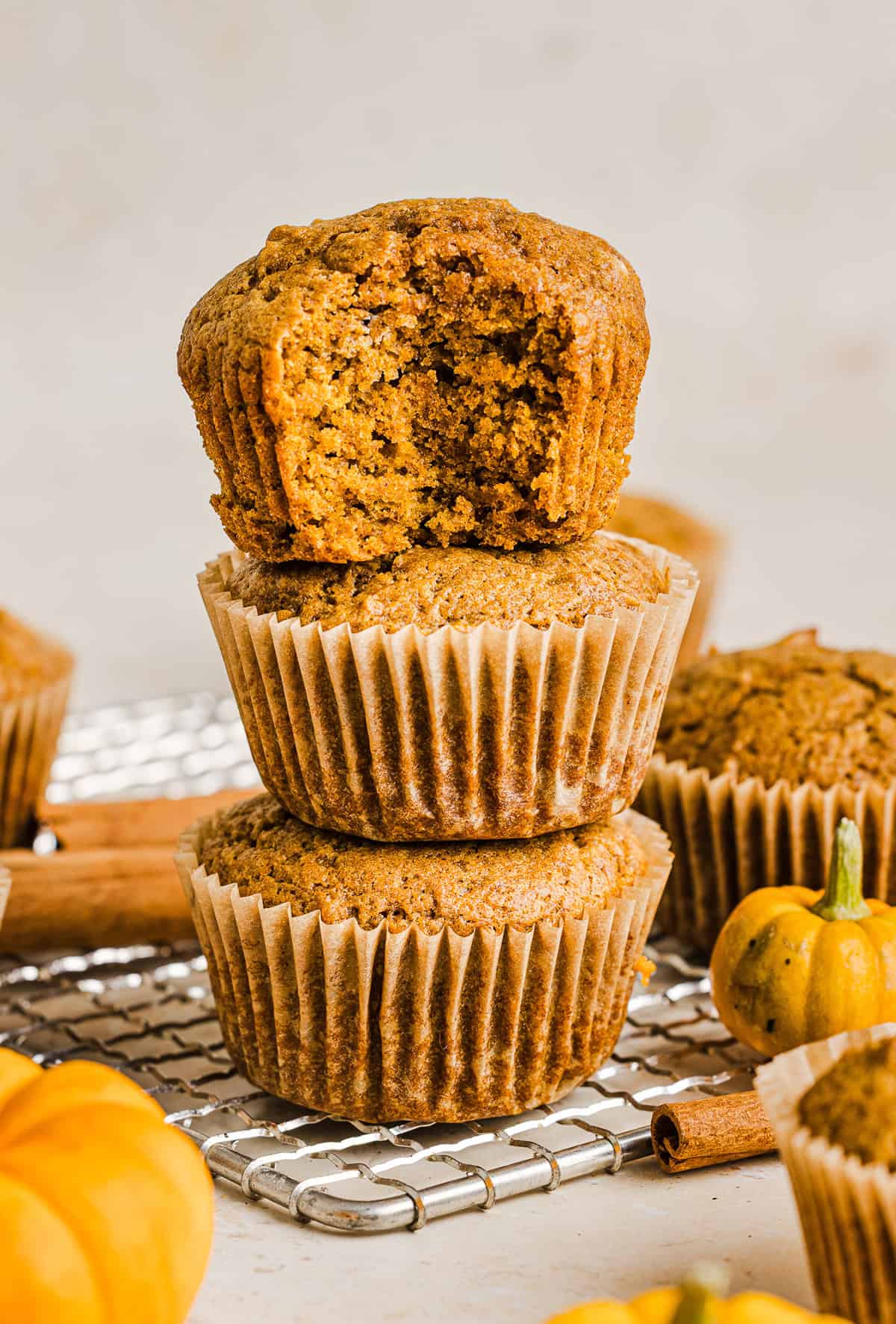 These Whole Wheat Pumpkin Muffins are moist, fluffy, and made healthier with whole wheat flour, applesauce, and zero butter or refined sugar.  Loaded with delicious pumpkin flavor and warm spices for the perfect fall muffin!
