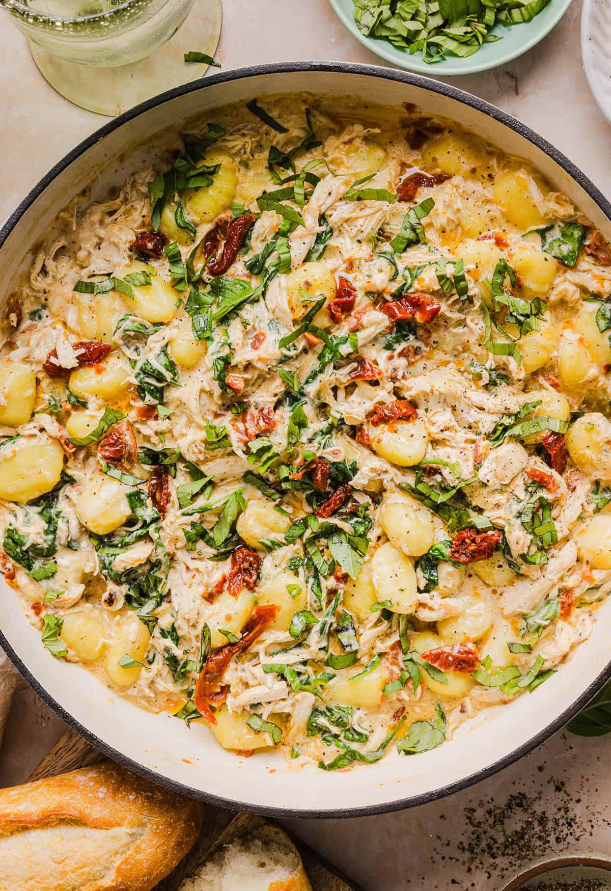 This EASY One Pan Marry Me Chicken and Gnocchi is the perfect weeknight meal! Pillowy soft gnocchi and tender chicken simmered together in a creamy sun dried tomato and parmesan sauce in just 20 minutes!